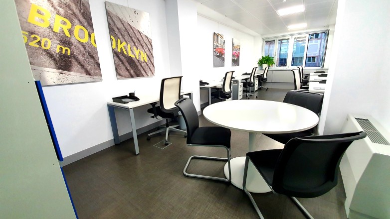 coworking area seven workstations with meeting table